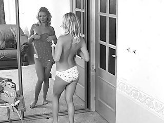 In front of the mirror this sexy girl tries on new outfits and shakes her ass.